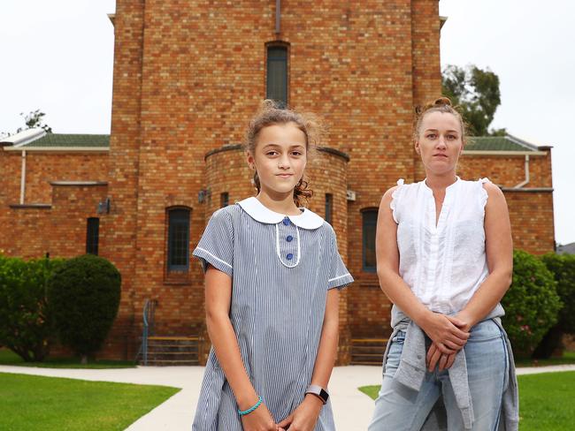 21/3/18: Annie Snell with her daughter Amelia Jarjoura outside St Philip Neri school in Northbridge, Sydney. The Turnbull government changes have forced people to leave the catholic school system. John Feder/The Australian.