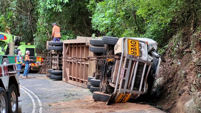 Crews at the scene of a truck rollover on February 1 on the Kuranda Range. The truck rolled over near the “hairpin” of the Kennedy Hwy, at Macalister Range. Picture: Brendan Radke