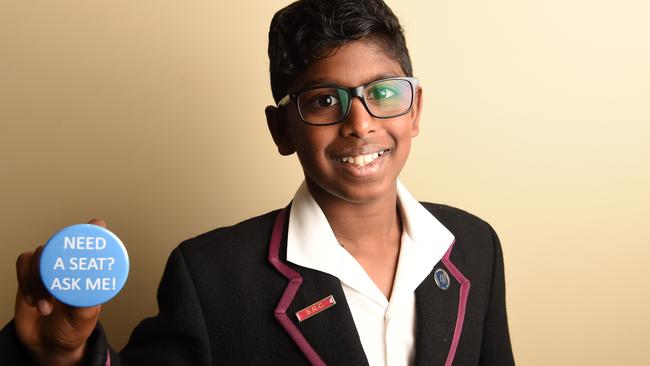 Last year’s <i>Great Australian Spelling Bee </i>winner Anirudh Kathirvel has come up with a badge which aims to give passengers with special needs more confidence to ask for a seat on public transport. Picture: Lawrence Pinder