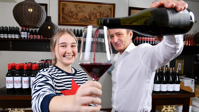 Jon Hamra owner of Hula Cellars part of Hula Hoop at Kensington Park serves Lucy Sullivan a glass of Tim Smith Wines Barossa MGS Picture: Mark Brake