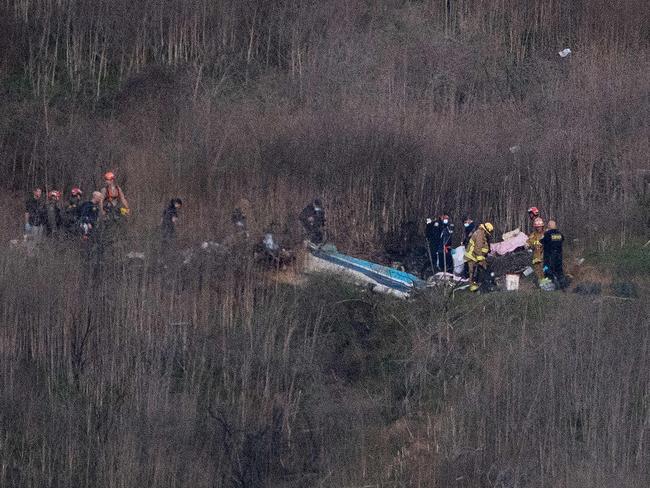 Recovery crews are tackling difficult terrain. Picture: AFP