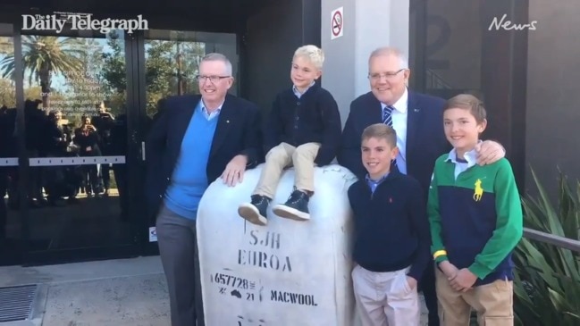 PM Scott Morrison high-fives youngsters at Bush Summit