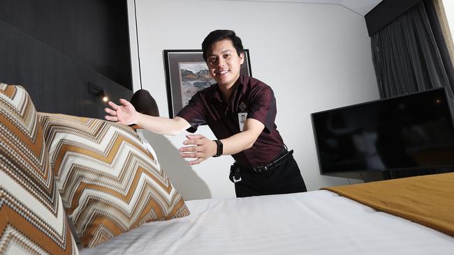 Wrest Point room attendant Saroj Thapa plumping pillows ahead of a mega weekend. Picture: LUKE BOWDEN