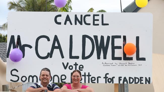 Andy and Chantal Lugg with the sign they put up in the front yard of their Hollywell home. Picture: Glenn Hampson.