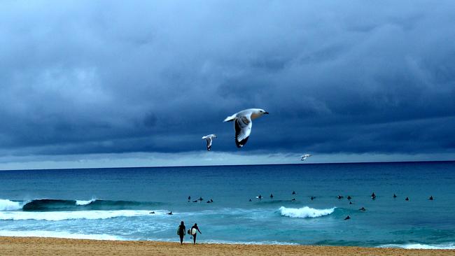 Police officers and a rescue helicopter were in the process of searching Maroubra Beach on Tuesday night. Picture: Jeremy Piper