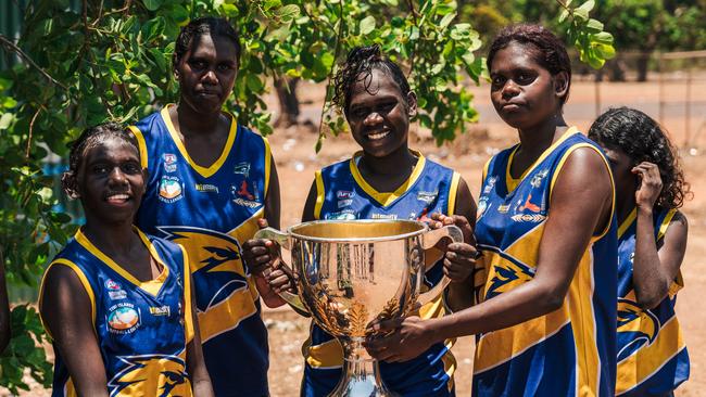 Player's from the inaugural Ranku Eagles Aussie rules team with the cup. Picture: Jono Laird.