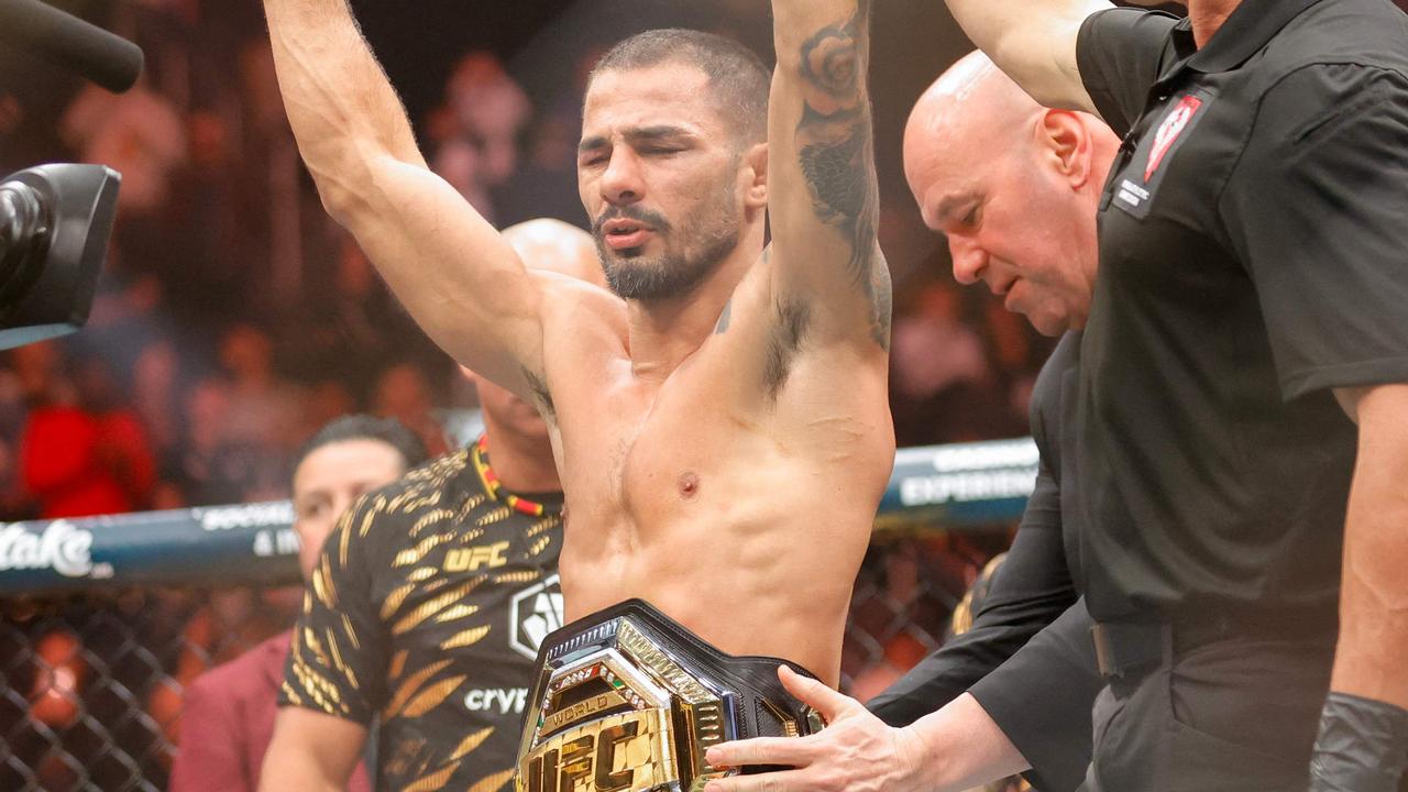 LAS VEGAS, NEVADA - DECEMBER 07: UFC CEO Dana White places a title belt on Alexandre Pantoja of Brazil after Pantoja's win by technical submission in the second round against Kai Asakura of Japan, not pictured, during UFC 310 at T-Mobile Arena on December 07, 2024 in Las Vegas, Nevada. Steve Marcus/Getty Images/AFP (Photo by Steve Marcus / GETTY IMAGES NORTH AMERICA / Getty Images via AFP)