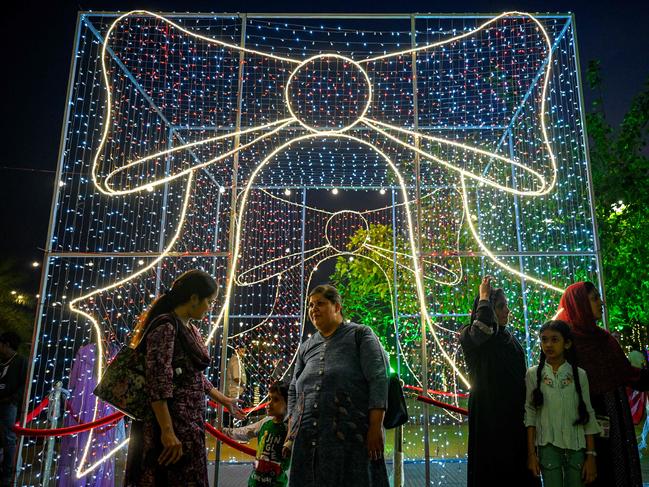 People gather at the illuminated sea promenade on New Year's Eve, in Mumbai on December 31, 2024. Picture: AFP