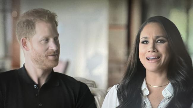 Harry and Meghan talking about their engagement in a scene from the docuseries. Picture: Netflix