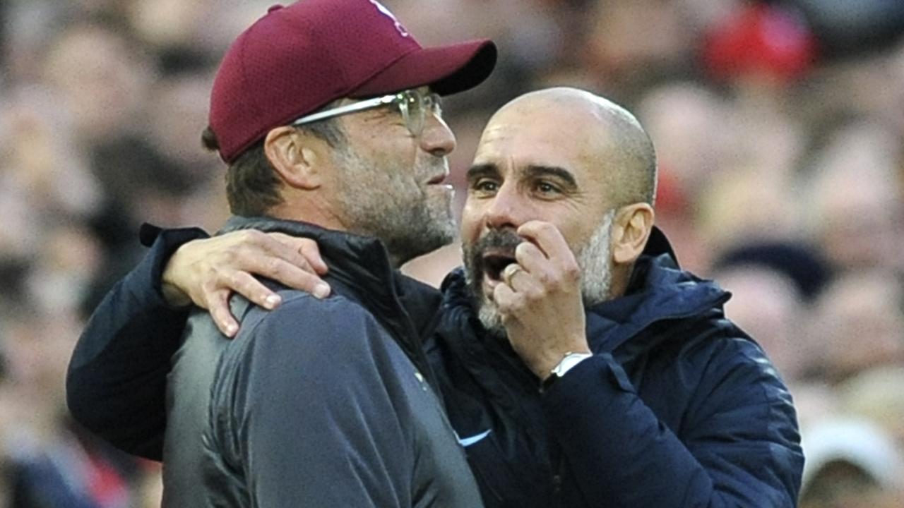 Manchester City manager Josep Guardiola, right, and Liverpool manager Juergen Klopp