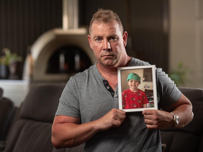 Grieving dad Stewart Edds holding a picture of his son James Edds, who was killed in the crash. Picture: Julian Andrews