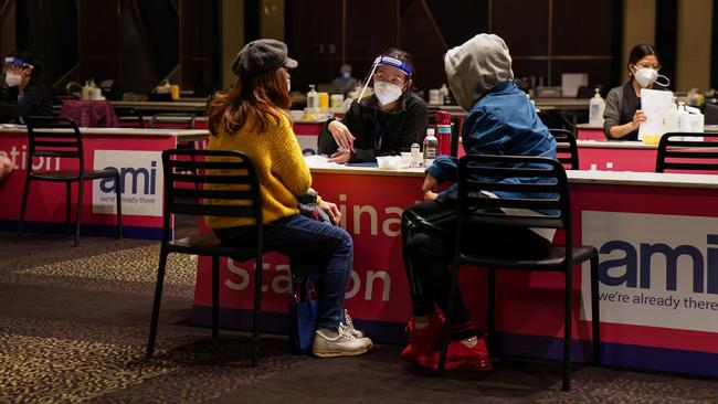 Nurse Kelie Lee, centre, prepares to administer the AstraZeneca vaccine at the Bankstown Sports Club in southwest Sydney on Wednesday. Picture: Reuters