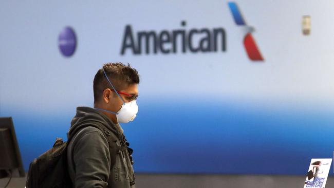 A passenger checks in for an American Airlines flight. Picture: AFP.