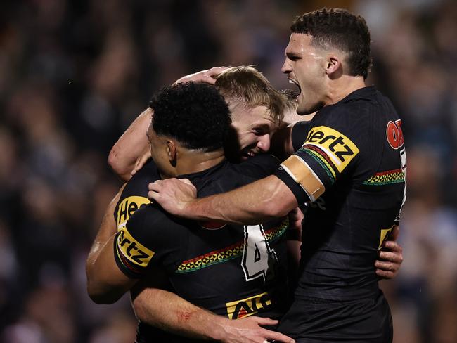 PENRITH, AUSTRALIA - SEPTEMBER 13: Luke Garner of the Panthers celebrates scoring a try with Paul Alamoti and Nathan Cleary of the Panthers during the NRL Qualifying Final match between Penrith Panthers and Sydney Roosters at BlueBet Stadium on September 13, 2024 in Penrith, Australia. (Photo by Cameron Spencer/Getty Images)