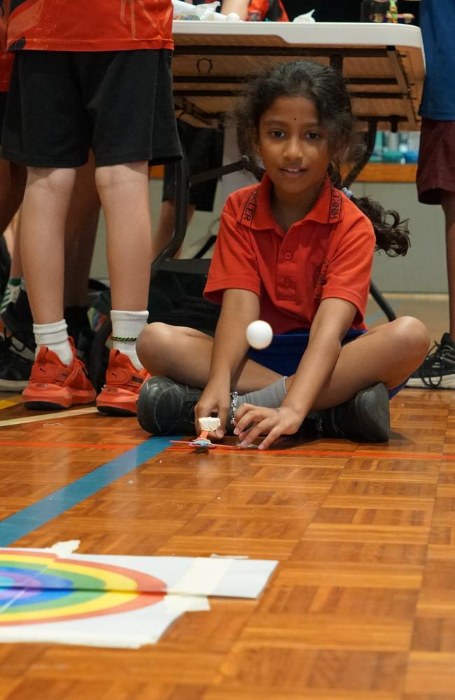 Shivani from Nakara Primary School using her freshly built catapult to understand angels at the Meaningful Maths day. Picture: Department of Education and Training NT