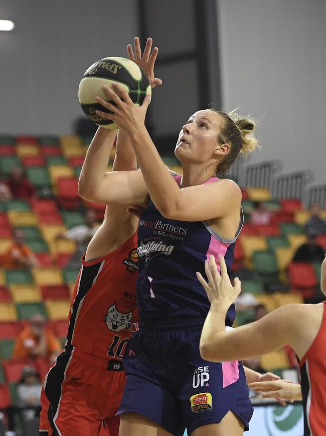 Brook, in Adelaide Lightning colours, makes a shot against Perth Lynx in Townsville. Picture: Ian Hitchcock/Getty Images.