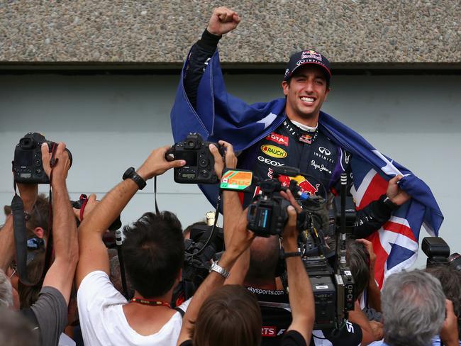 Daniel Ricciardo is carried aloft by his pit crew following his first grand prix victory during the Canadian Formula One Grand Prix last year. Picture: Tom Pennington/Getty Images