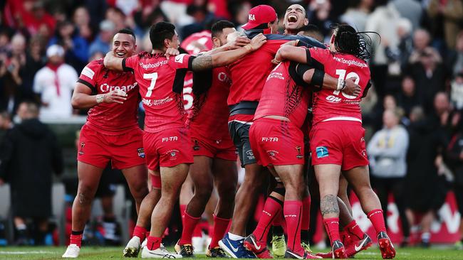 Tonga celebrate beating New Zealand in their World Cup match last week. Photo: Getty Images