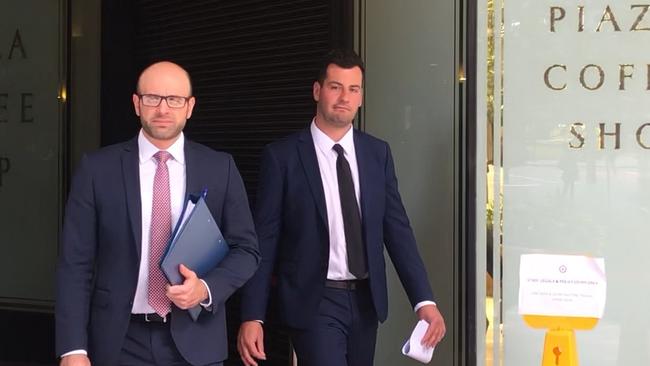 The northern beaches man (right) leaves Downing Centre Local Court with his lawyer.