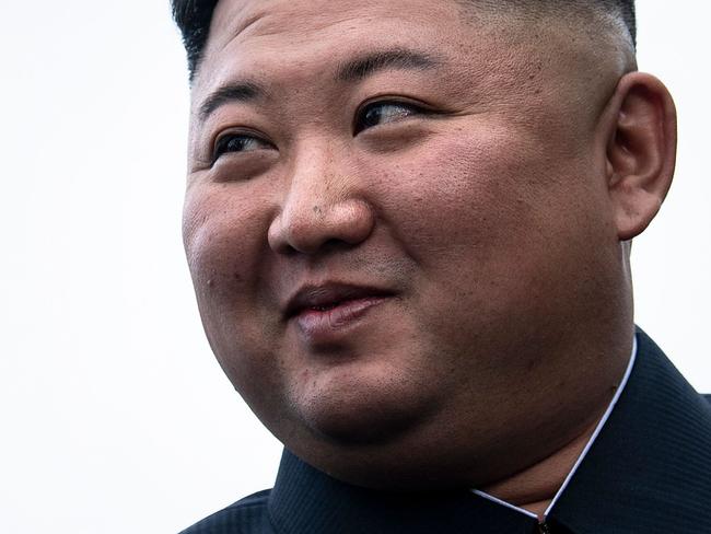 TOPSHOT - US President Donald Trump and North Korea's leader Kim Jong-un talk before a meeting in the Demilitarized Zone(DMZ) on June 30, 2019, in Panmunjom, Korea. (Photo by Brendan Smialowski / AFP)