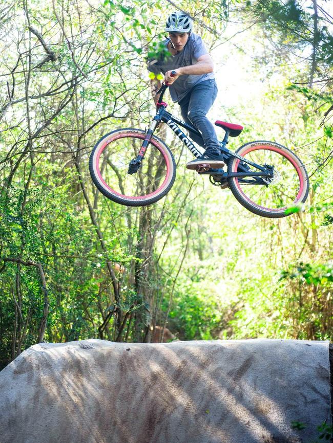 Sam Stockwell, 23, at the unofficial jump site near the Grove Bike Park at Seaforth. Picture: Supplied.