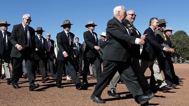 Veterans march in last year’s 2013 Anzac Day National Ceremony at the Australian War Memorial in Canberra. 