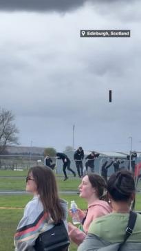 Young lads jump fence at music festival