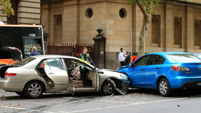 Police and emergency services attend a motor vehicle accident on Lonsdale Street, Melbourne. Picture: Mark Stewart
