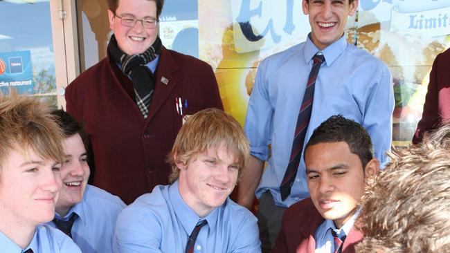 Chris Lawrence (C), in 2006 after a matchwinning performance in his first grade debut with the Tigers on the weekend, pictured with his student mates at St Gregory's College at Campbelltown, after taking a trial HSC exam.