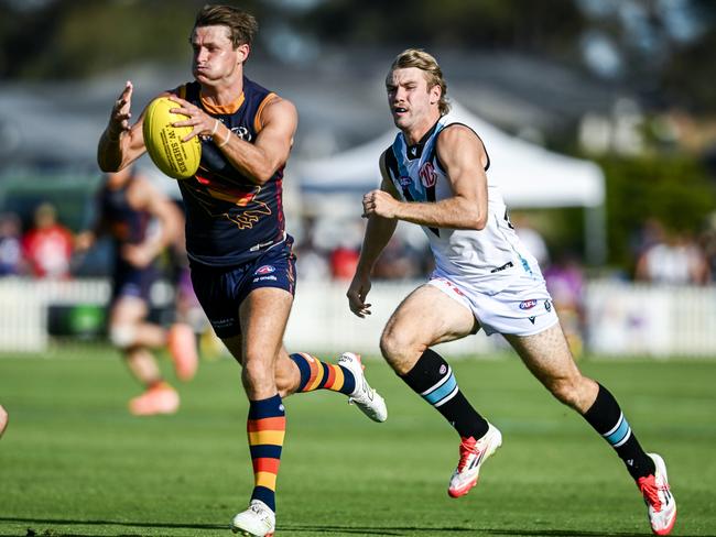 MT BARKER, AUSTRALIA - FEBRUARY 21:Matt Crouch of the Crows in front of Jason Horne-Francis of the Power  during the AFL practice match between Adelaide Crows and Port Adelaide Power at Mt Barker Summit Sport and Recreation Ground on February 21, 2025 in Mt Barker, Australia. (Photo by Mark Brake/Getty Images)