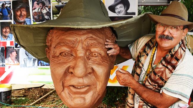 Farvardin Daliri with the statues he has created for the culture fest.