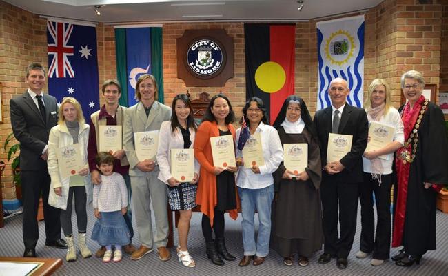 Lismore City Council general manager Gary Murphy (far left) and Lismore mayor Jenny Dowell (far right) with new citizens after the Citizenship Ceremony at the council chambers on Tuesday. Picture: Terra Sword