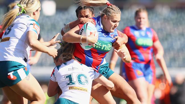 CANBERRA, AUSTRALIA - AUGUST 03: Caitlan Johnston-Green of the Knights is tackled during the round two NRLW match between Canberra Raiders and Newcastle Knights at GIO Stadium on August 03, 2024 in Canberra, Australia. (Photo by Mark Nolan/Getty Images)