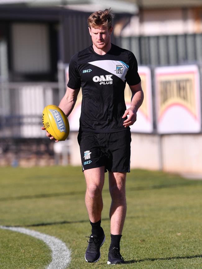 Tom Jonas walks laps at Power training this week. He will miss the Carlton game with a recurrence of a hamstring injury. Picture: AAP Image/David Mariuz