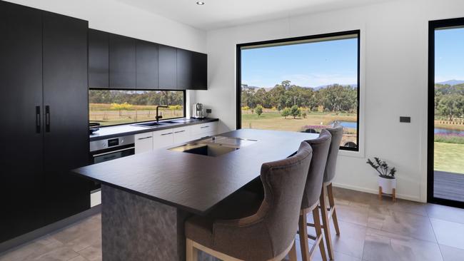 The kitchen with high-end appliances and a teppanyaki grill.