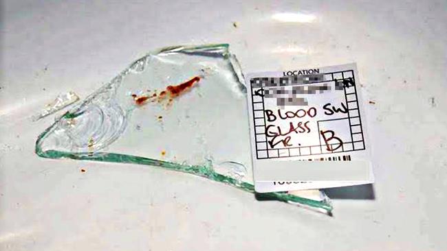 A broken shard of glass with a red smear labelled ‘blood’ by police. The Queensland government’s DNA testing laboratory initially found &amp;quot;insufficient DNA for further testing.s Picture: Supplied