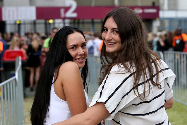 Georgia Kilpatrick and Jessie Kleist, both of Albion, eagerly awaing the start of the Adele concert at the Gabba on Saturday, March 4. Picture: Steve Pohlner
