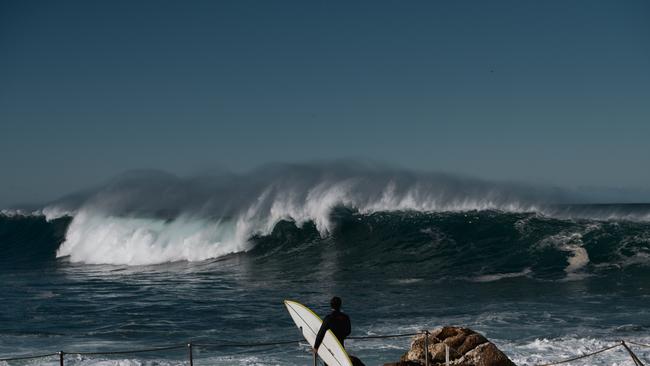 Despite the warning, some keen surfers braved the conditions. Picture: NCA NewsWire / Flavio Brancaleone