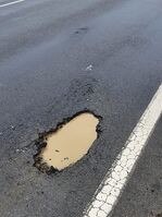 One of the many potholes across the Hunter after a deluge of rain. Picture: Supplied.