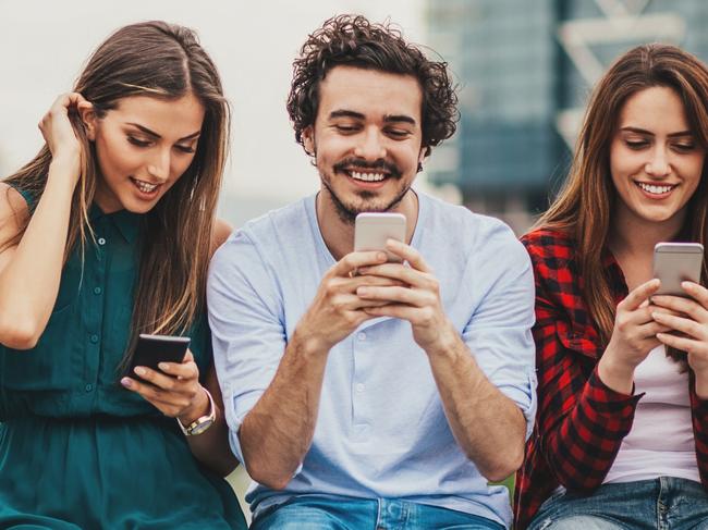 A group of people all on their mobile phones. Picture: iStock.