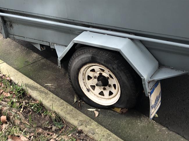 A trailer, with a flat tyre, “permanently” parked in Wheeler Pde, Dee Why, on Tuesday. Picture: Manly Daily