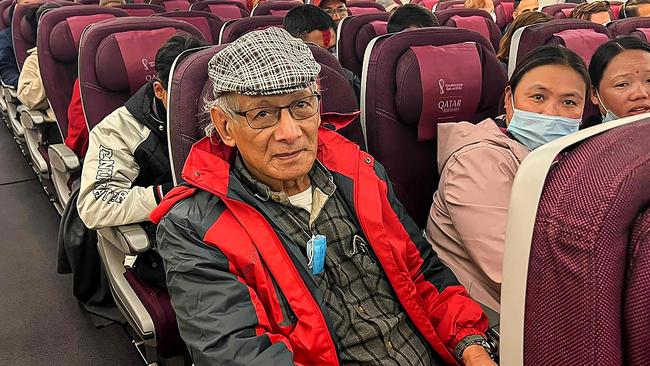 French serial killer Charles Sobhraj (C) sits in an aircraft departing from Kathmandu to France after his jail release. Picture: Atish PATEL / AFP