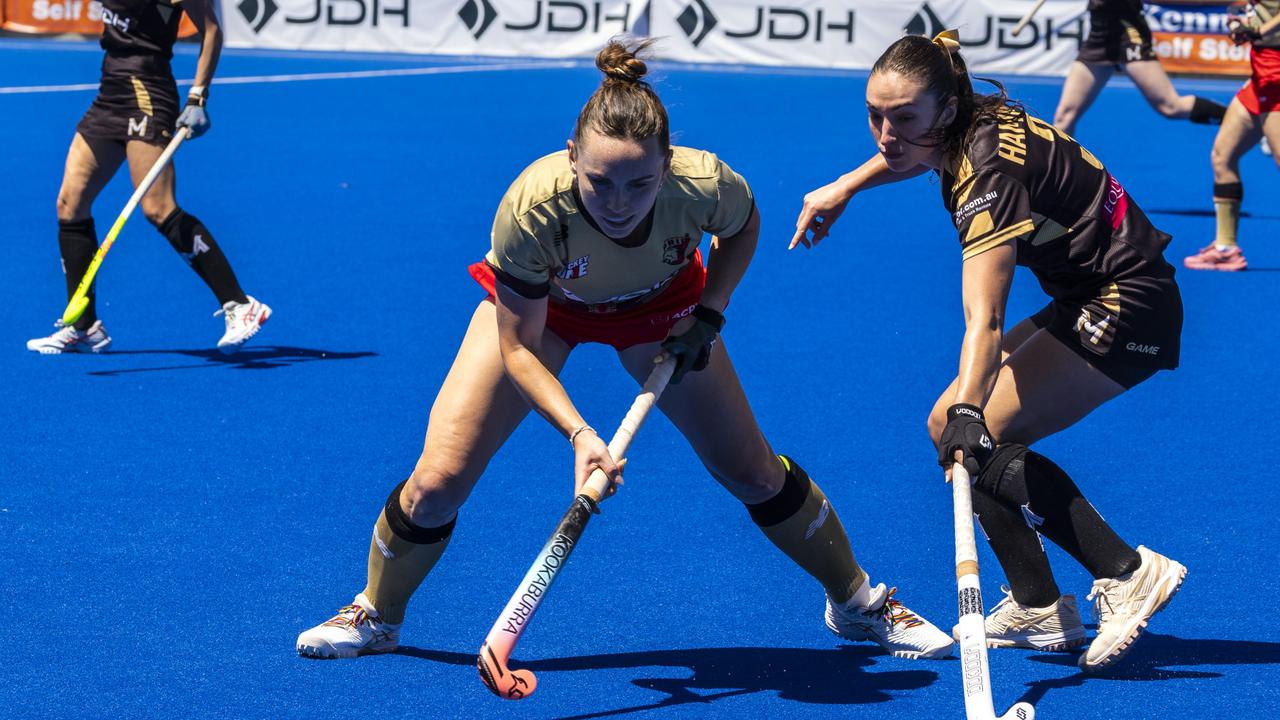 NSW PRIDE Greta Hayes (red) vs. Hockey Melbourne. Picture: Andrea Francolini