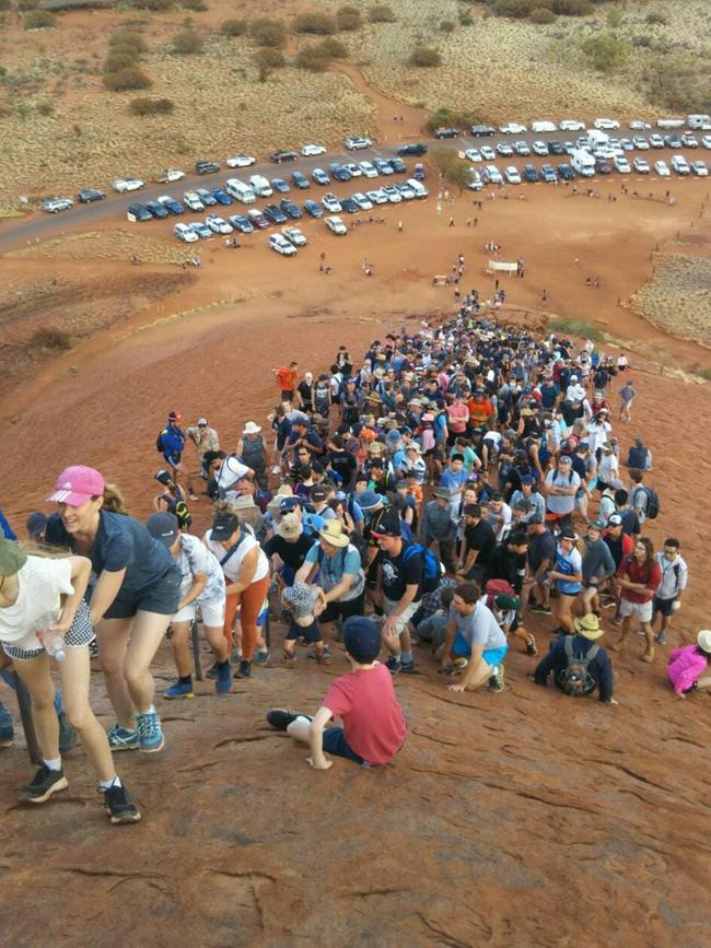 <s1>This incredible photo shows the huge number of tourists climbing Uluru on one of the last days before the climb closes on October 26. Picture: Supplied</s1>