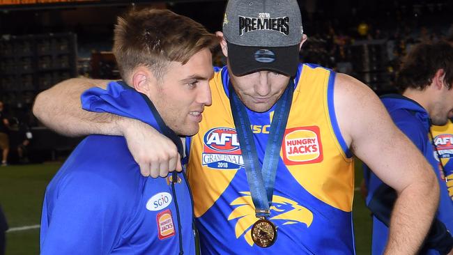 Brad Sheppard gets a hug from Jeremy McGovern after the Grand Final.