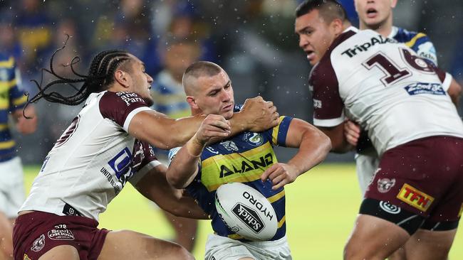 Manly's Martin Taupau hits Parramatta's Raymond Stone high and is sent to the sin bin during the Parramatta v Manly NRL match at Bank West Stadium, Parramatta. Picture: Brett Costello