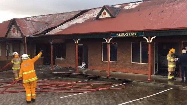 A fire broke out in a group of shops at Woodcroft this morning, causing extensive damage to a hairdresser, dental surgery and doctor. Picture: 7 NEWS