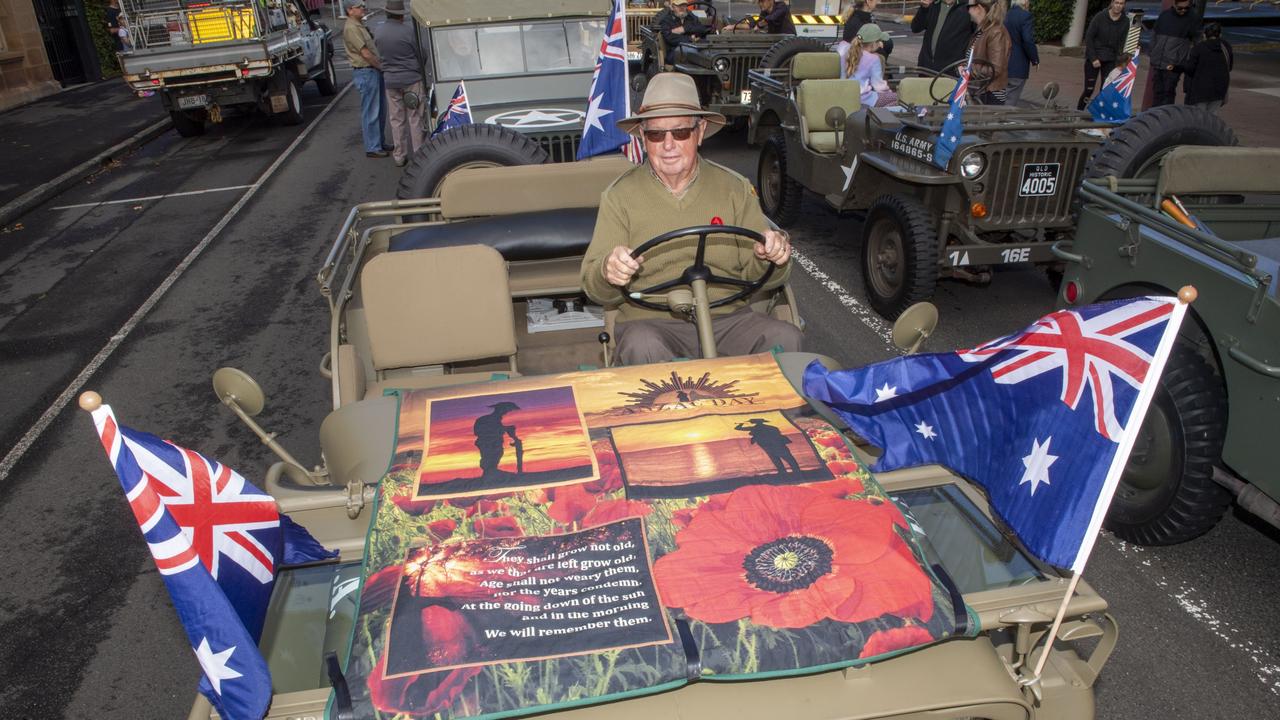 Bill Fischer in his Willys with a quilt made by his wife Del. Assembly in Neil St for the mid morning parade on ANZAC DAY. Tuesday, April 25, 2023. Picture: Nev Madsen.