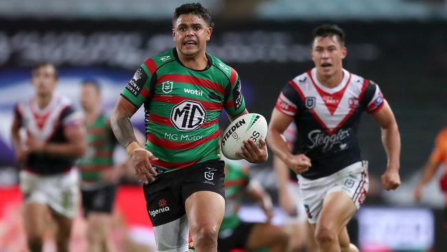 Latrell Mitchell leaves Joey Manu behind as he races away to score. Picture: Matt King/Getty Images