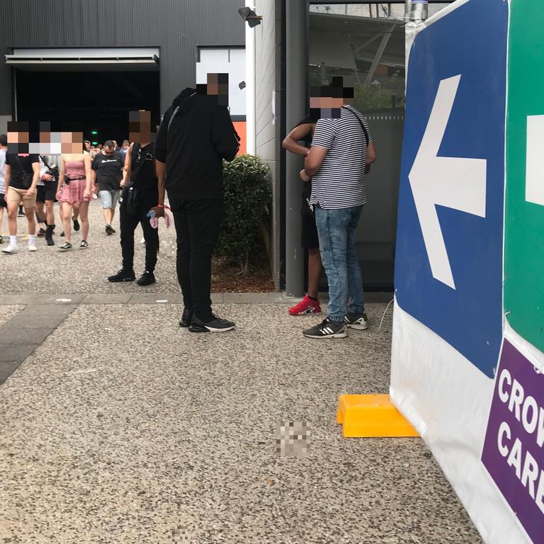 The three young men stand metres from DanceWize’s crowd care centre.